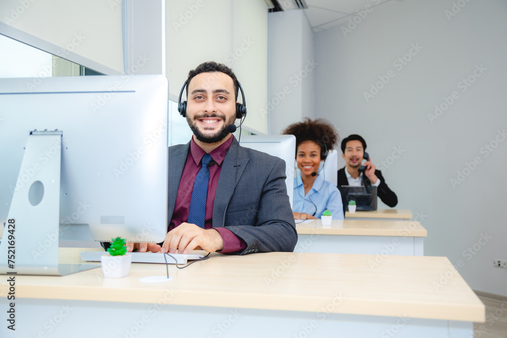 Customer service, call center or telemarketing team and manager or mentor looking happy reading online feedback or sale on website. Diversity people, support sales consultant training office