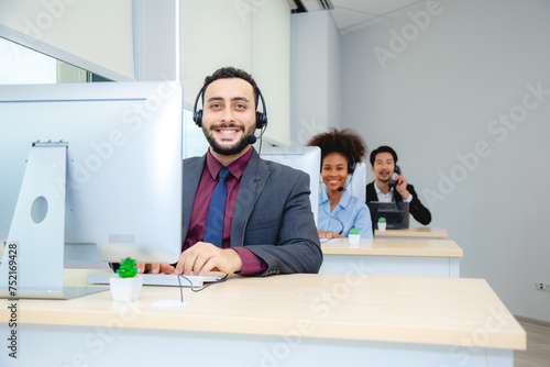 Customer service, call center or telemarketing team and manager or mentor looking happy reading online feedback or sale on website. Diversity people, support sales consultant training office