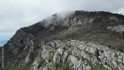 Peak of a mountain with a steep cliff. Montenegro.