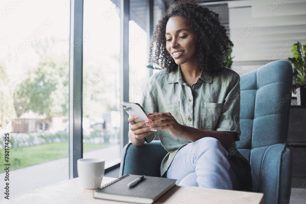 © kite_rin - Businesswoman texting on mobile phone in office lobby. Young student woman using smartphone at cafe. Online communication, business lifestyle, work or study connection, mobile apps, technology concept © kite_rin - Businesswoman texting on mobile phone in office lobby. Young student woman using smartphone at cafe. Online communication, business lifestyle, work or study connection, mobile apps, technology concept