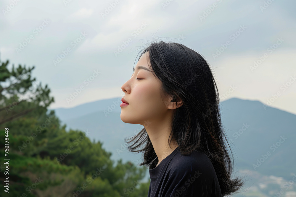 Elevated Tranquility: Asian Woman in Alpine Serenity