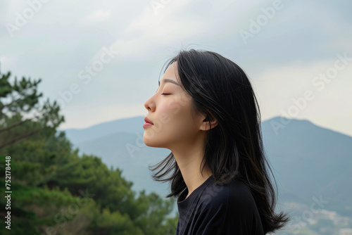 Elevated Tranquility: Asian Woman in Alpine Serenity