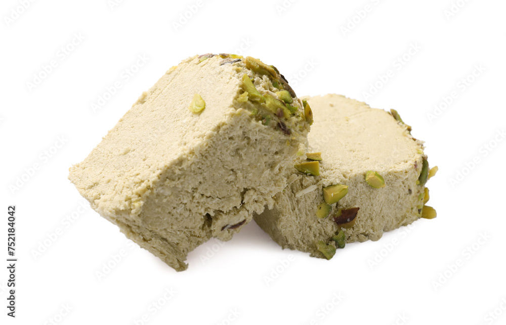 Pieces of tasty halva with pistachios on white background Pieces of tasty halva with pistachios on white background