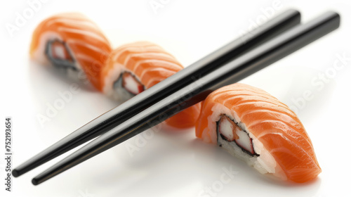 chinese chopsticks with sushi on white background