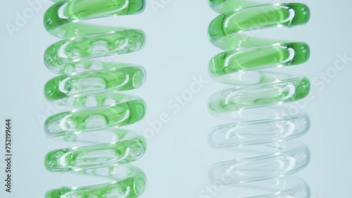 Obtaining an extract from natural herbs and algae. Natural cosmetics production. Obtaining a medicinal extract from herbs. The technician mixes the green reagent with water in a flask.