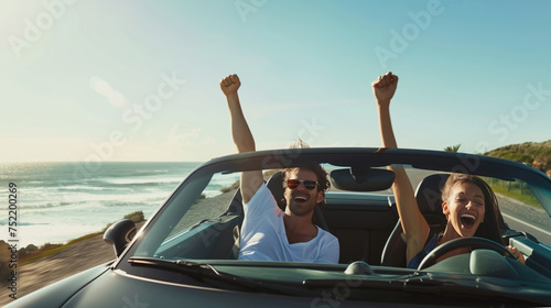Romantic trip. A young couple enjoys a ride in a classic vintage sports car. Concept of travel, modern cars and romantic vacation.