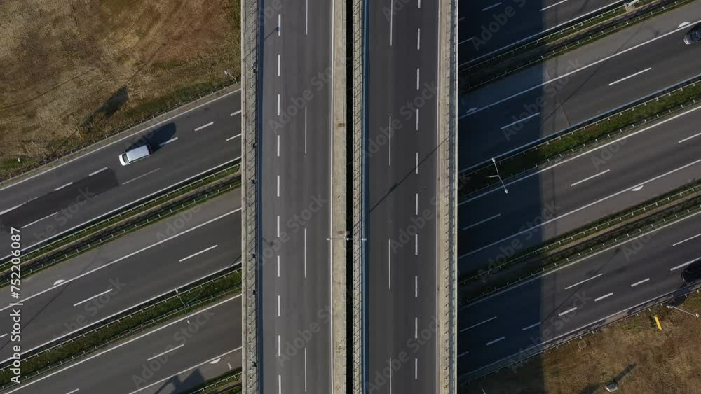 Aerial shot of cars on freeway overpass from drone pov Aerial shot of cars on freeway overpass from drone pov