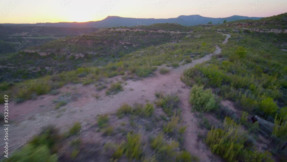 Acrobatic drone flying around a hip-hop dancer in the desert. Acrobatic drone flying around a hip-hop dancer in the desert.