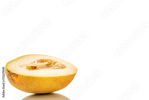 One half of sweet melon, macro, isolated on white background.