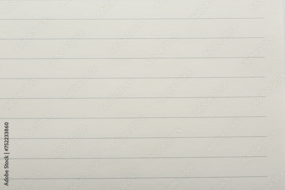 Lined notebook sheet as background, top view Lined notebook sheet as background, top view