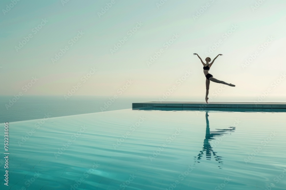 Fototapeta premium Bailarina de ballet bailando en el borde de una piscina infinita, fotografía minimalista al atardecer 