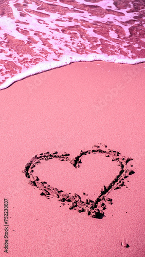 Sea coast. Inscription heart on beach sand Pink toning. Vertical banner