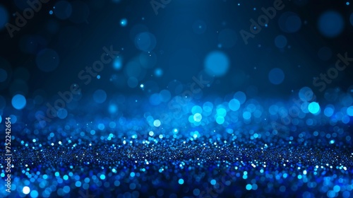 A mesmerizing sea of blue glitter with out-of-focus light dots, conveying a sense of serenity and wonder. © tashechka