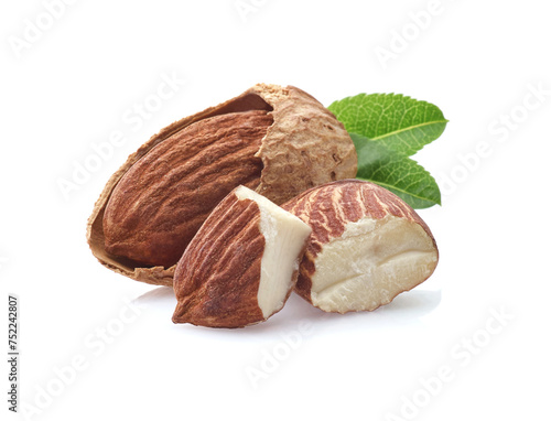Almonds kernel with leaves on white background