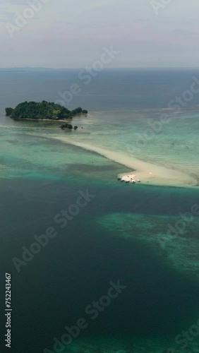 Tropical Islands with sandy beach in Barobo, Surigao del Sur. Philippines. Vertical view. photo