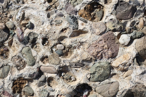 фотографія Top view a conglomerate composed of rounded to subangular gravel-size clasts
