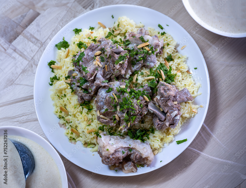 mansaf and jameed served on table, with copy space mansaf and jameed served on table, with copy space