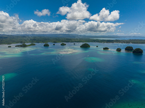 Top view of small islands under blue sky. Nature and travel concept. Mindanao, Philippines.