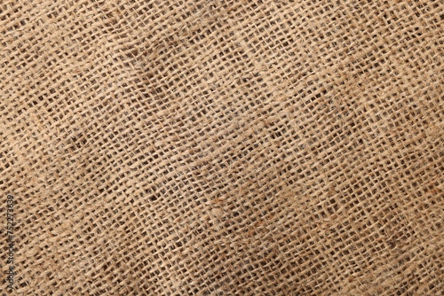 Texture of natural burlap fabric as background  top view