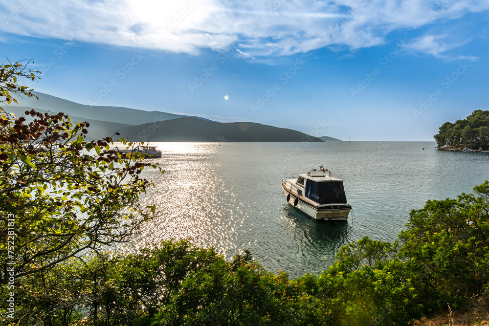 Boat anchoring in a beautiful bay (Osor) on the island of Cres-Losinj in the Adriatic Sea, Croatia Boat anchoring in a beautiful bay (Osor) on the island of Cres-Losinj in the Adriatic Sea, Croatia