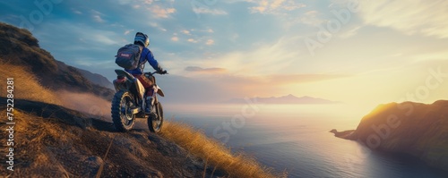 Back view of man riding a off-road motorcycle  going up to steep cliff.