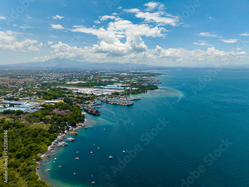 Blue sea and sky with clouds, view from the drone. General Santos Fishport. Mindanao, Philippines.