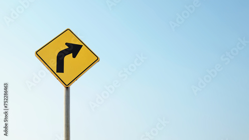 Traffic sign against bright sky background. Directional turn right. Guidance concept. Choose the right way.