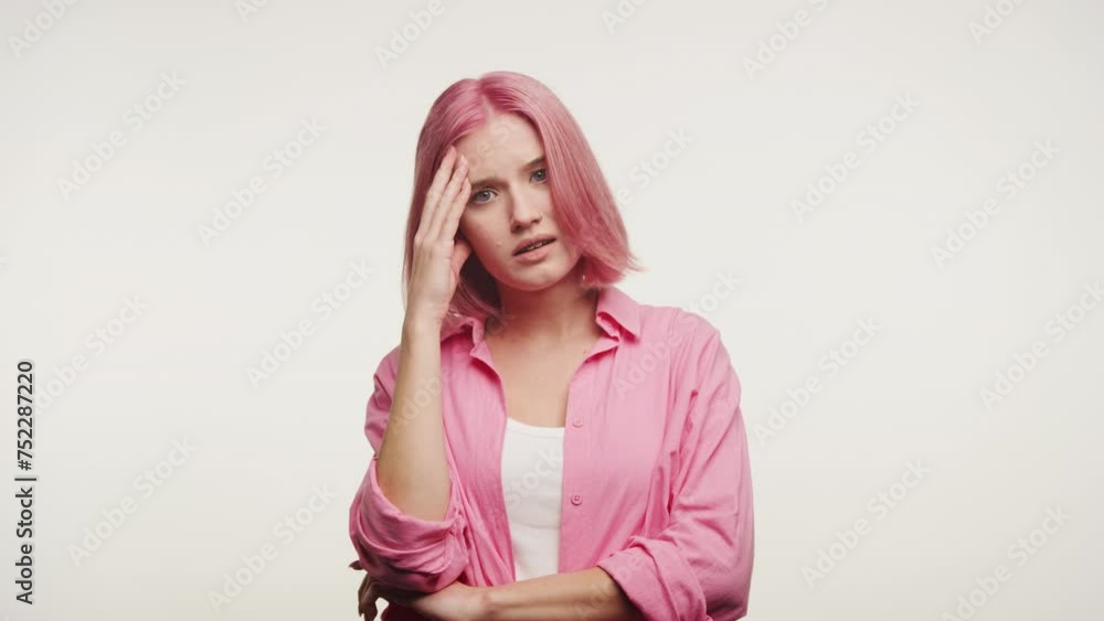 Concerned Pink-Haired Woman Holding Head Concerned Pink-Haired Woman Holding Head