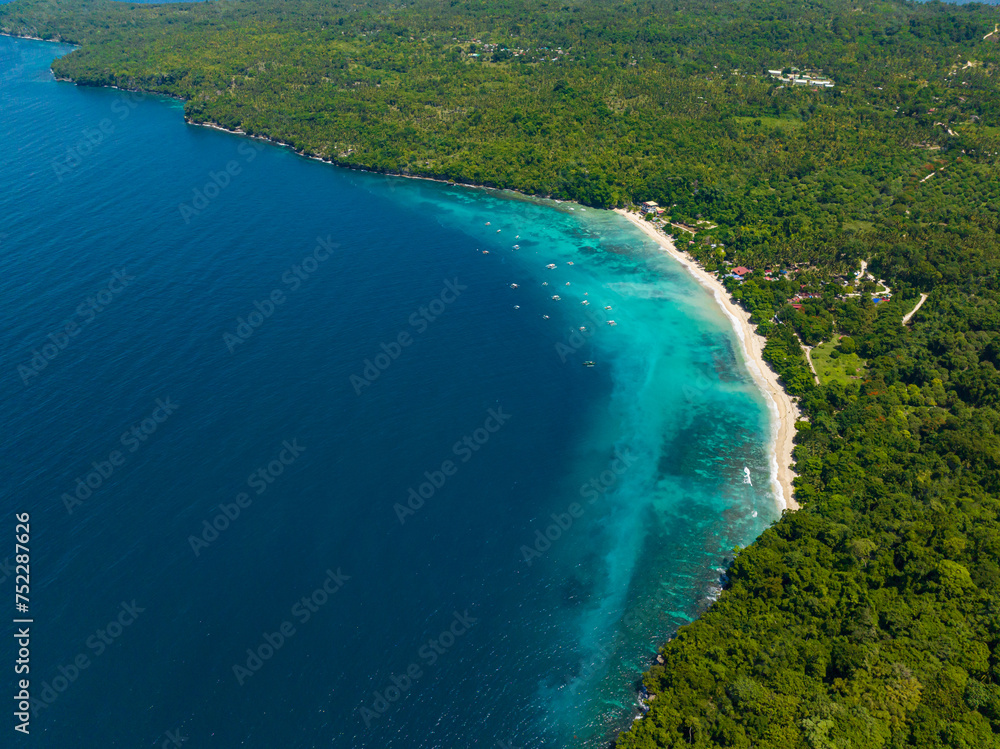 Drone view of beach resort with white sand and blue sea. Samal Island. Davao, Philippines.
