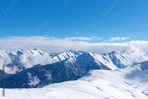 Fototapeta Naklejka Na Ścianę i Meble -  Beautiful landscape of the Arkhyz ski resort with mountains, snow, forest on sunny winter day. Caucasus Mountains, Russia.