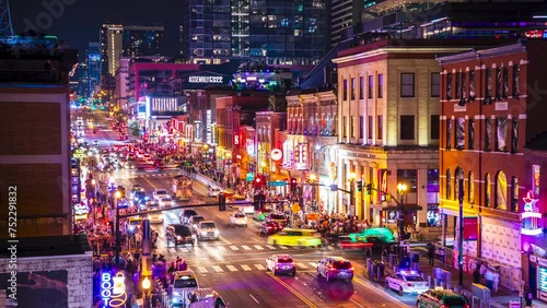 A vibrant 4K aerial timelapse capturing the energy of Broadway in Nashville, Tennessee bustling with traffic and lively crowds visiting the bars and honky-tonks. photo
