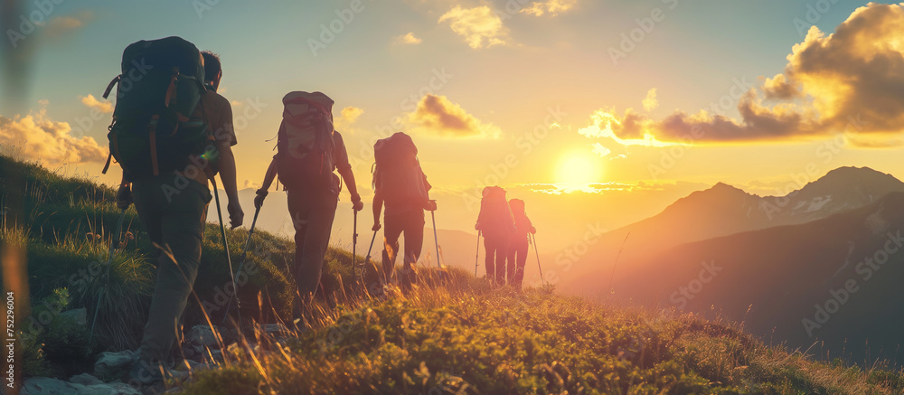 Hikers with backpacks on the trail in the mountains at sunset. - obrazy, fototapety, plakaty 