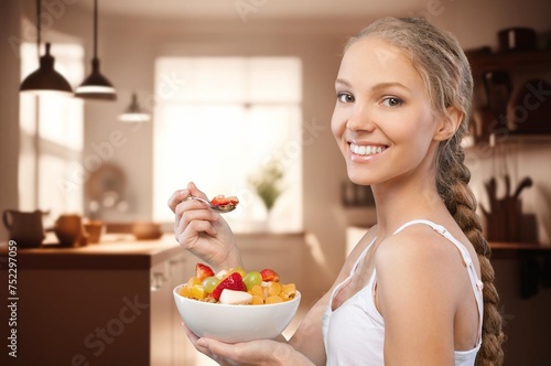 Shot of athletic healthy person eating fresh salad