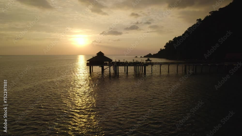 Beautiful drone video of a tropical Island sunset over the sea Beautiful drone video of a tropical Island sunset over the sea