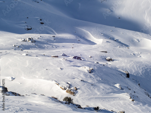 Wind-Swept Snow in Pyrenees Mountain Panorama with Backcountry Ski Tracks