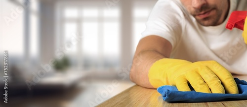 Wallpaper Mural Person cleaning using cloth and disinfectant in room Torontodigital.ca