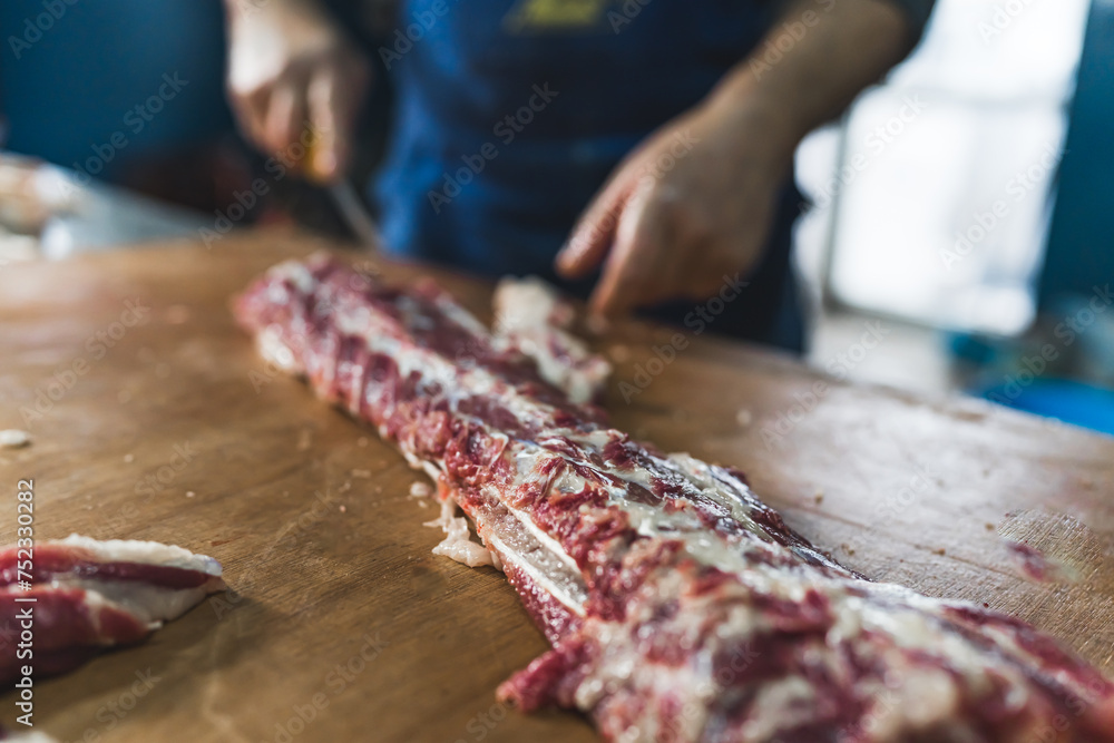 Meat on bones, ready for preparing. Manufacturing of meat concept. Fresh pig ribs. High quality photo Meat on bones, ready for preparing. Manufacturing of meat concept. Fresh pig ribs. High quality photo