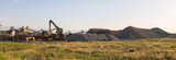Heavy equipment works at a sand processing quarry
