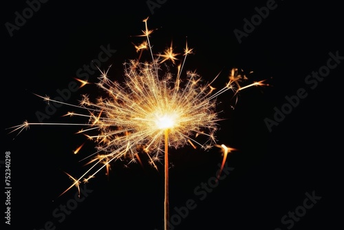 Sparks of a sparkler on a black background.