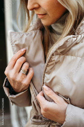 Woman Wearing Jacket and Ring © Ala