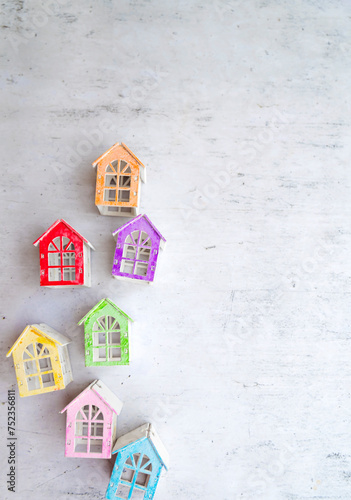 Real estate market concept with colorful wooden houses figurines