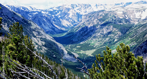 Spectacular view at Beartooth Highway Wyoming. A Drive of incredible beauty. Yellowstone. Alpine mountains covered by snow and green woods. Northwest. Majestic beartooth mountains landscape. Road trip photo