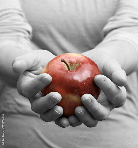 hand with red apple start dieting with an apple with people stock image stock photo	 photo