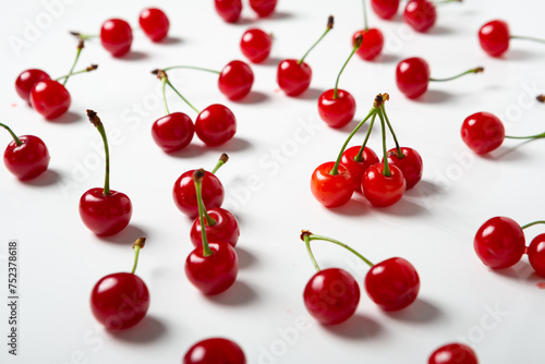 ripe red sour cherries close up on light surface summer background