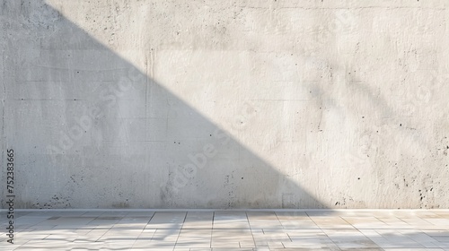 Shadow cast by the sun over a white concrete wall.