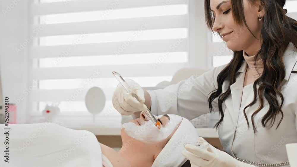 Cosmetic procedure face mask: A skin restoration product enriched with useful components that improve its condition and appearance in a beauty salon from a cosmetologist Cosmetic procedure face mask: A skin restoration product enriched with useful components that improve its condition and appearance in a beauty salon from a cosmetologist