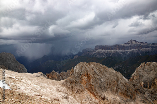 The view of Sassolungo and the Sella Group from Serauta in stormy weather in the Dolomites, Italy. photo