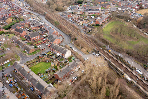 Aerial photo of the town of Darton in Barnsley in Yorkshire UK, showing the town and housing estates next to the train tracks on a cold day in the winter time, photo