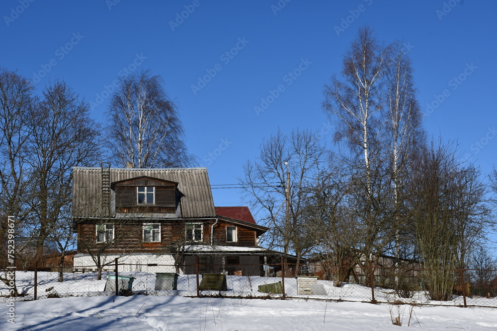 house in winter forest house in winter forest
