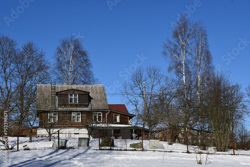 house in winter forest